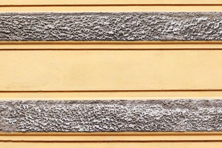 orange textured wall with gray accentsの写真素材