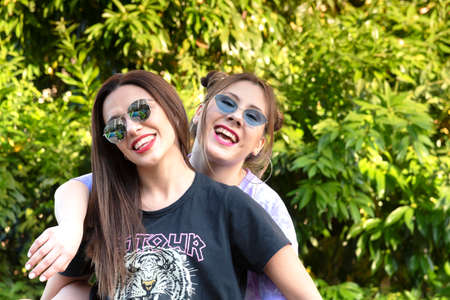 young women enjoying a walk in the city on a summer afternoon