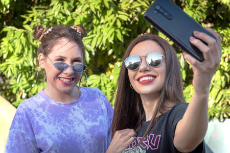 young women enjoying a walk in the city on a summer afternoon