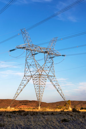 high voltage towers on a hydroelectric dam to distribute electricity in patagonia