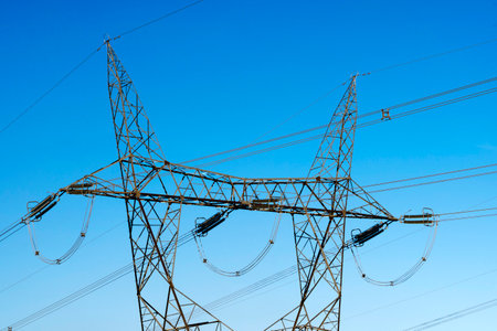 high voltage towers on a hydroelectric dam to distribute electricity in patagonia