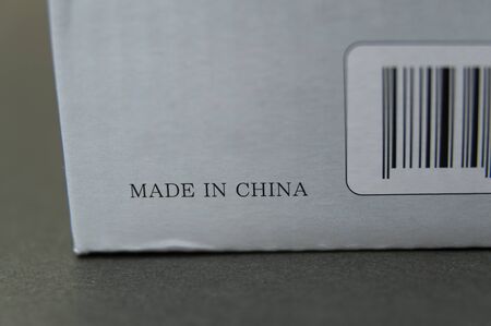 Gray cardboard box with bar code written: MADE IN CHINA. Product marketed in Japan.の写真素材