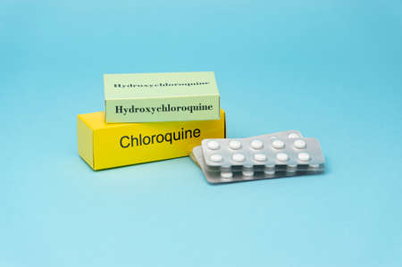 Treatments for Coronavirus (COVID-19): Hydroxychloroquine and Chloroquine. Isolated on blue...