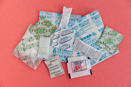 Fuji City, Shizuoka Prefecture, Japan - April 4, 2020: Various bags of silica gel used in processed foods and nutritional supplements from Japan and other countries. Horizontal shot.のeditorial素材