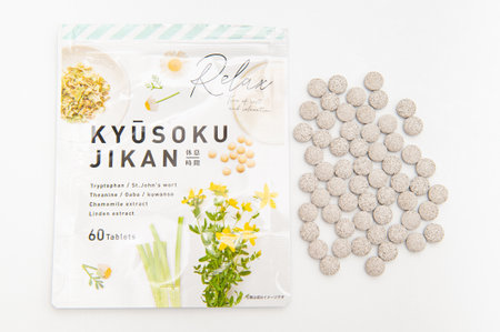 Fuji City, Shizuoka-Ken, Japan - April 29, 2021: Kyusoku Jikan. GABA, Serotonin, St. John's Wort, Tryptophan, Supplement by MBI Co. Ltd., Japan. Scattered pills. Isolated on white background.のeditorial素材