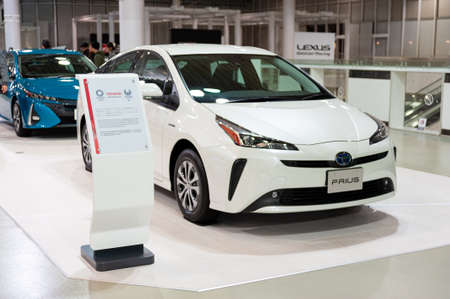 Odaiba, Tokyo, Japan, Toyota Showcase Mega Web Palette Town - January 2, 2020: White Toyota Prius Plug-in Hybrid aka Prius PHV and Prius Prime in the United States of America.のeditorial素材