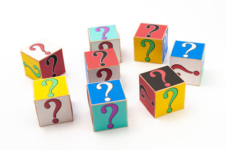 Question mark written on wooden blocks isolated on white background in top view.