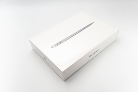 Fuji-shi, Shizuoka-ken, Japan - March 11, 2022: MacBook Air M1 in closed packaging isolated on white background.のeditorial素材