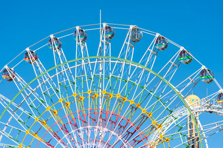 Fuji-Q Highland, Fujiyoshida City, Yamanashi Prefecture, Japan - January 3, 2019: Ferris Wheel at Fuji-Q Highland Amusement Park. Background with beautiful blue sky.のeditorial素材