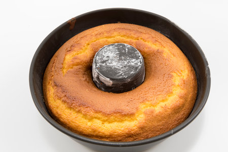Traditional and delicious homemade Brazilian carrot cake in the pan. Isolated on white background.の写真素材