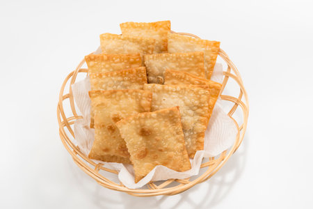 Homemade Pastel, traditional Brazilian snack in top view isolated on white background.の写真素材