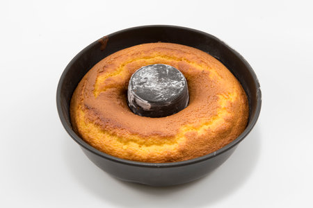 Traditional and delicious homemade Brazilian carrot cake in the pan. Isolated on white background.の写真素材