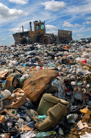 The bulldozer buries food and industrial wastesの写真素材