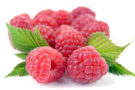 Raspberry with leaves on a white background