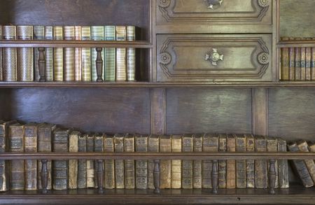 Old books in a book caseの写真素材