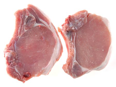 Pork steak with a stone on a white backgroundの写真素材