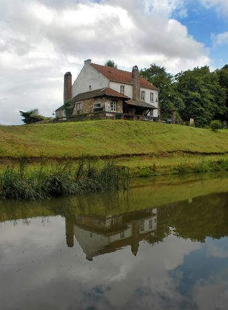 Village houses with reflection in a pondの写真素材