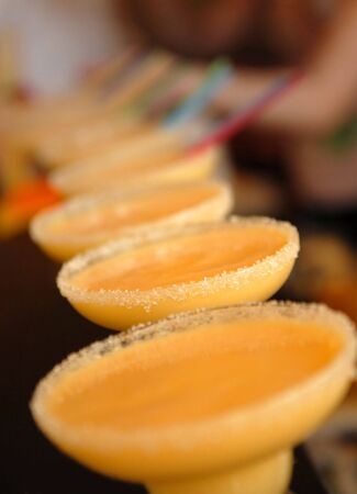 A number of cocktails in glasses with sugarの写真素材