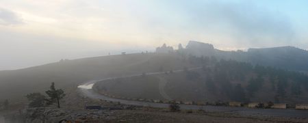 Fog and clouds in the morning on a slope of the Crimean mountains