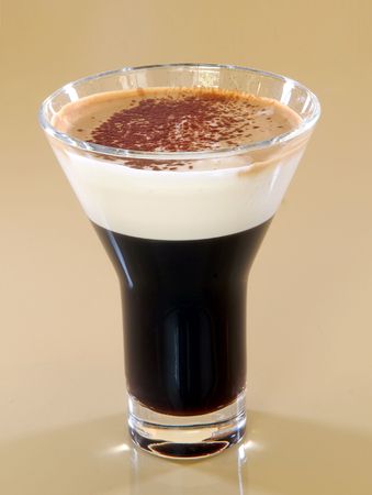 Mug of layered caffe latte on a table