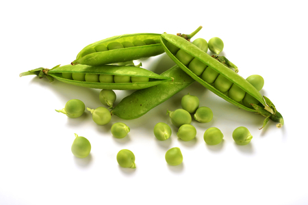 Pods of green peas isolated on a white background. Green ripe fresh vegetables. Legumes.の写真素材