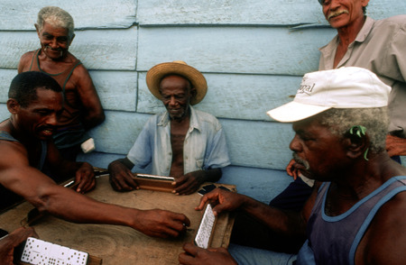 Old men playing dominos on street in Trinidad, Cuba, West Indies, Central America.のeditorial素材