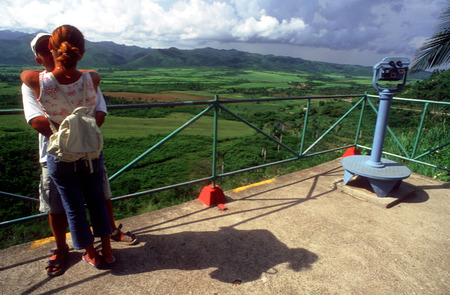Love, couple. Viewpoint and binoculars at the viewpoint overlooking Valle de los Ingenios a former sugar producing area near Trinidad, Cubaのeditorial素材