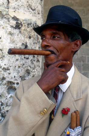 Portrait of Cuban man smoking cigar Havana Vieja Cubaのeditorial素材
