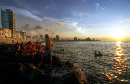 Local people along the famous Malecon on the waterfront in the Old City of Havana.のeditorial素材