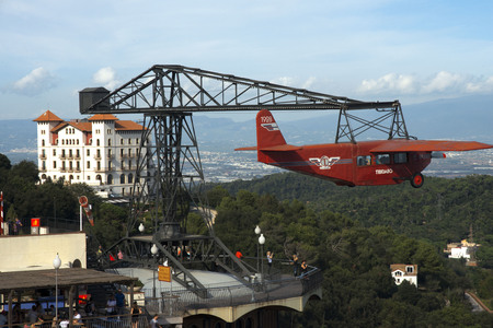 Airplane carousel in Tibidabo Amusement Park, Tibidabo, Barcelona, Spain. The Tibidabo theme park, Barcelona, Spain. Tibidabo is a mountain overlooking Barcelona, Catalonia, Spain. At 512 meters it is the tallest mountain in the Serra de Collserola. Risinのeditorial素材