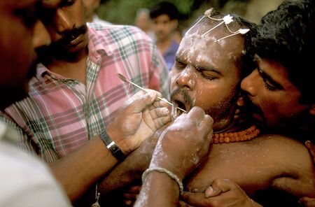 Hindus taking part in Thaipusam, during a pilgrimage to the Batu Caves north of Kuala Lumpur in Malaysaia.のeditorial素材