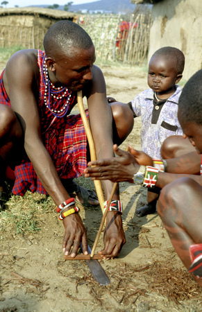 Maasai semi-nomadic people located in Masai Mara National Reserve Kenya Africa. A Maasai near his cabin that are normally built with branches and logs smeared with feces from their own oxen.のeditorial素材