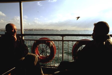 Inside ferry from Ãskudar to EminÃ¶nÃ¼, turkish flag, Istambul, Turkeyのeditorial素材
