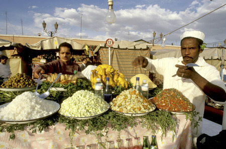 Food stall at Djemaa el Fna square. People dining at the food stalls at sunset. Marrakesh, Moroccoのeditorial素材