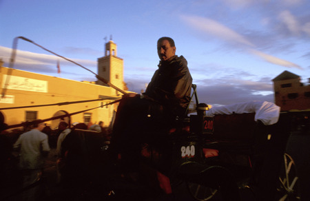 Horse and carriage with tourists in the Jemaa el Fna square Marrakech Moroccoのeditorial素材