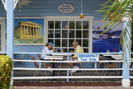 BAHAMAS, Grand Bahama Island, Lucaya: Port Lucaya Marketplace, Cally's Restaurant. Count Basie Square, colonial colorful wooden houses.のeditorial素材