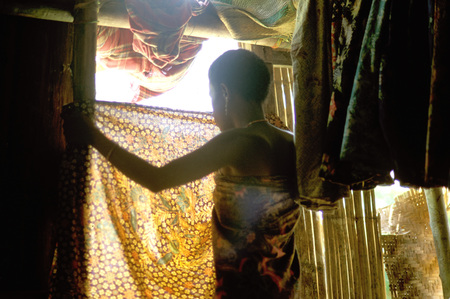 Orang Asli tribe in Taman Negara National Park in central Malaysia. Woman inside the hut.のeditorial素材