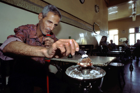Cafe Arab League. Jordanian Arabs in cafe smoking Nargileh pipes Amman Jordan.