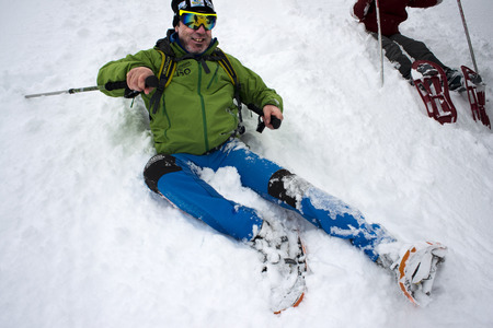 Baqueira Beret, Ski resort, Pyrenees, Aran Valley, Lleida, Catalonia, Spain. People walking with snow rackets towards the summit of a snowy hill.のeditorial素材