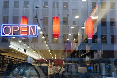 Neon sign advertising fresh coffee at a delicatessen in New York on Sunday, USA.のeditorial素材