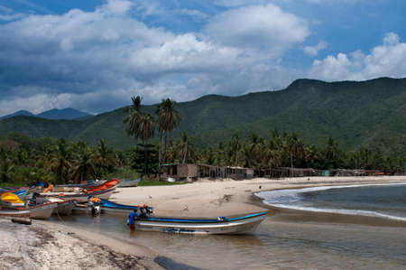 Boats in Chuao beach in Falcon state in Venezuela - Henri Pittier National Park, in Venezuela.  It presents a big touristy interest, by being one of the starting points towards the islands of Morrocoy National Park, together with Tucacas. There, you can hのeditorial素材