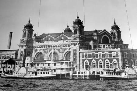 Photo Wall in the Ellis Island Immigration Museum near Manhattan New York City New York USA North America. Ellis Island. This island was the main gateway to all immigrants arriving in New York from 1892-1954. At present, and based on photographs, luggage のeditorial素材