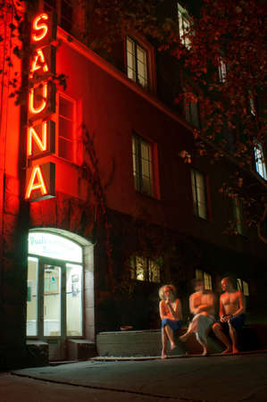 LUMINOUS SIGN FOR THE KOTIHARJU SAUNA AT NIGHT HELSINKI FINLAND EUROPE. A neon sign for a public sauna in SÃ¶rnÃ¤inen, Helsinki, Finland.のeditorial素材