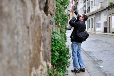 Photographer at work in search of interesting perspectiveの写真素材