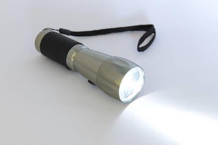 Electric headlight lighted, isolated on a white background