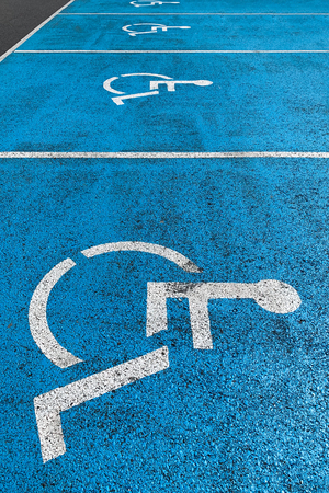 image of blue marking on asphalt disabled parkingの写真素材