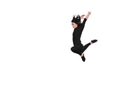 young woman doing gymnastic jump isolated on a white backgroundの写真素材