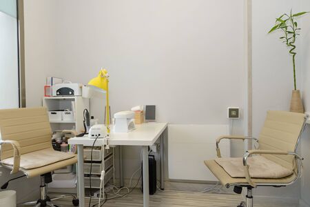 view of empty room of a medical clinic with equipment for manicureの写真素材