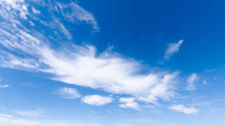 image of white cumulus clouds on a blue sky, bright sunny day, beautiful natural landscape