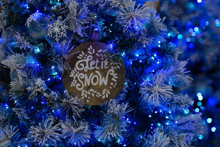 Christmas decorations on the Christmas tree with text let it snow, close-upの写真素材